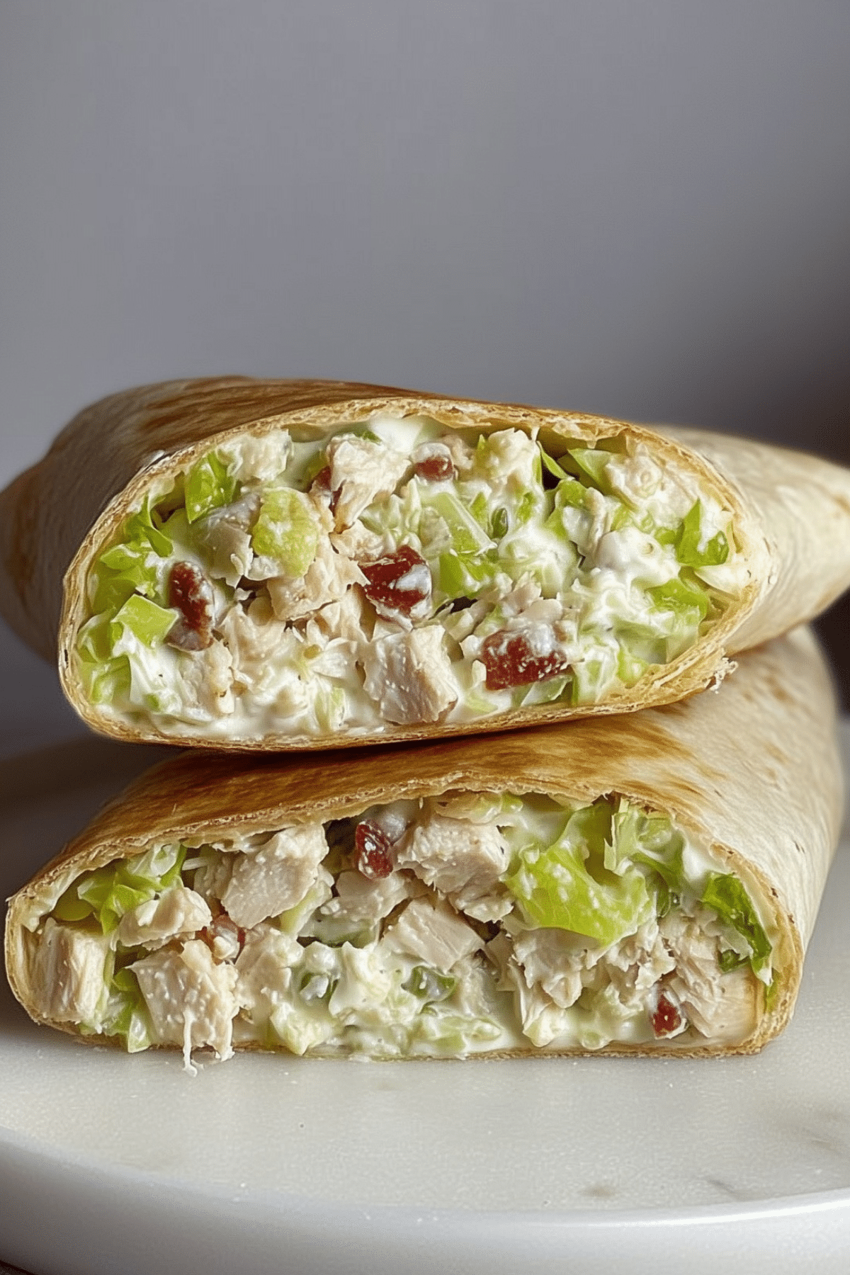 Chicken Caesar Salad Wraps with grilled chicken, romaine lettuce, parmesan, and Caesar dressing in tortilla