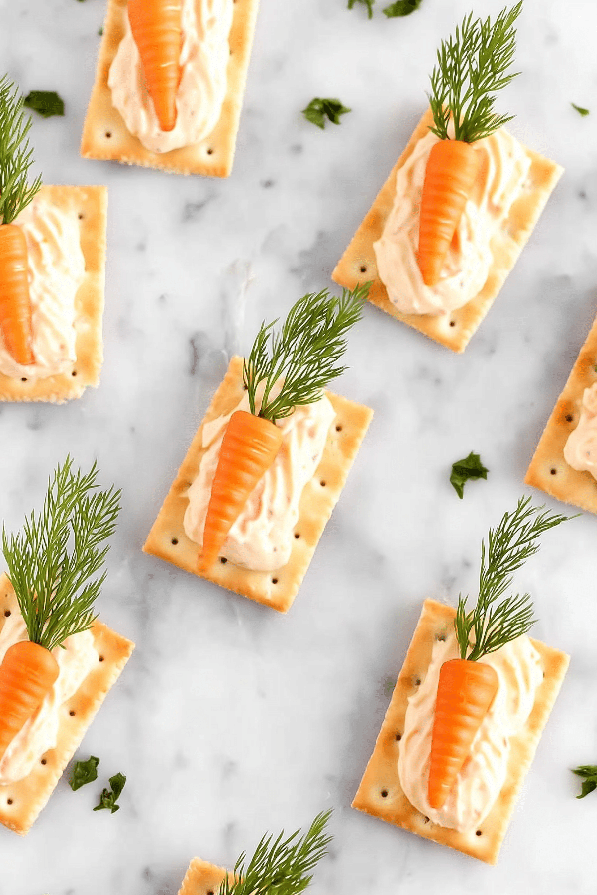 Easter Carrot Bites appetizer with cream cheese filling and dill garnish